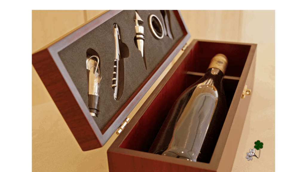 a nice wooden box with a boittle of wine and a wine opening kit.