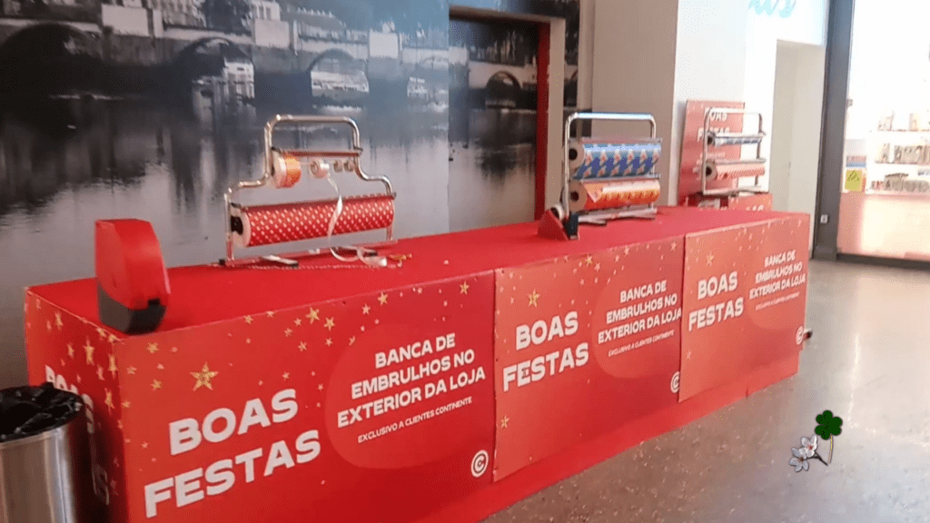 a gift wrapping station at a local chain supermarket continente in Portugal during Christmas time