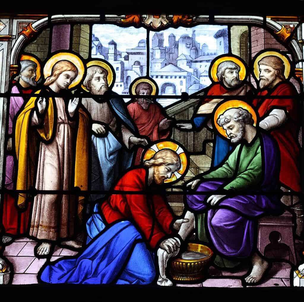 Stained glass of Jesus washing the feet of the apostoles during the Last Supper