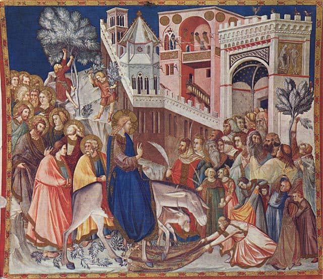 Medieval painting of Jesus entering Jerusalem on a donkey on Palm Sunday
