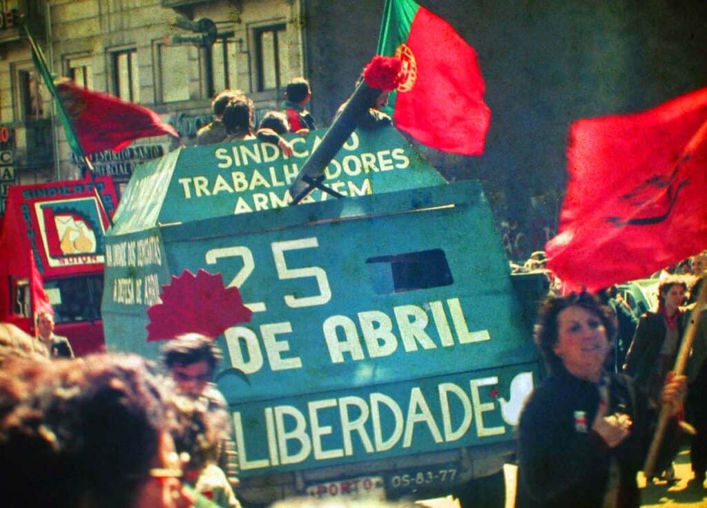 Carnation Revolution 1974 Portugal civilians and soldiers celebrating with carnations